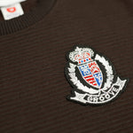 Load image into Gallery viewer, Royal Crest Brown Sweatshirt crest badge close-up