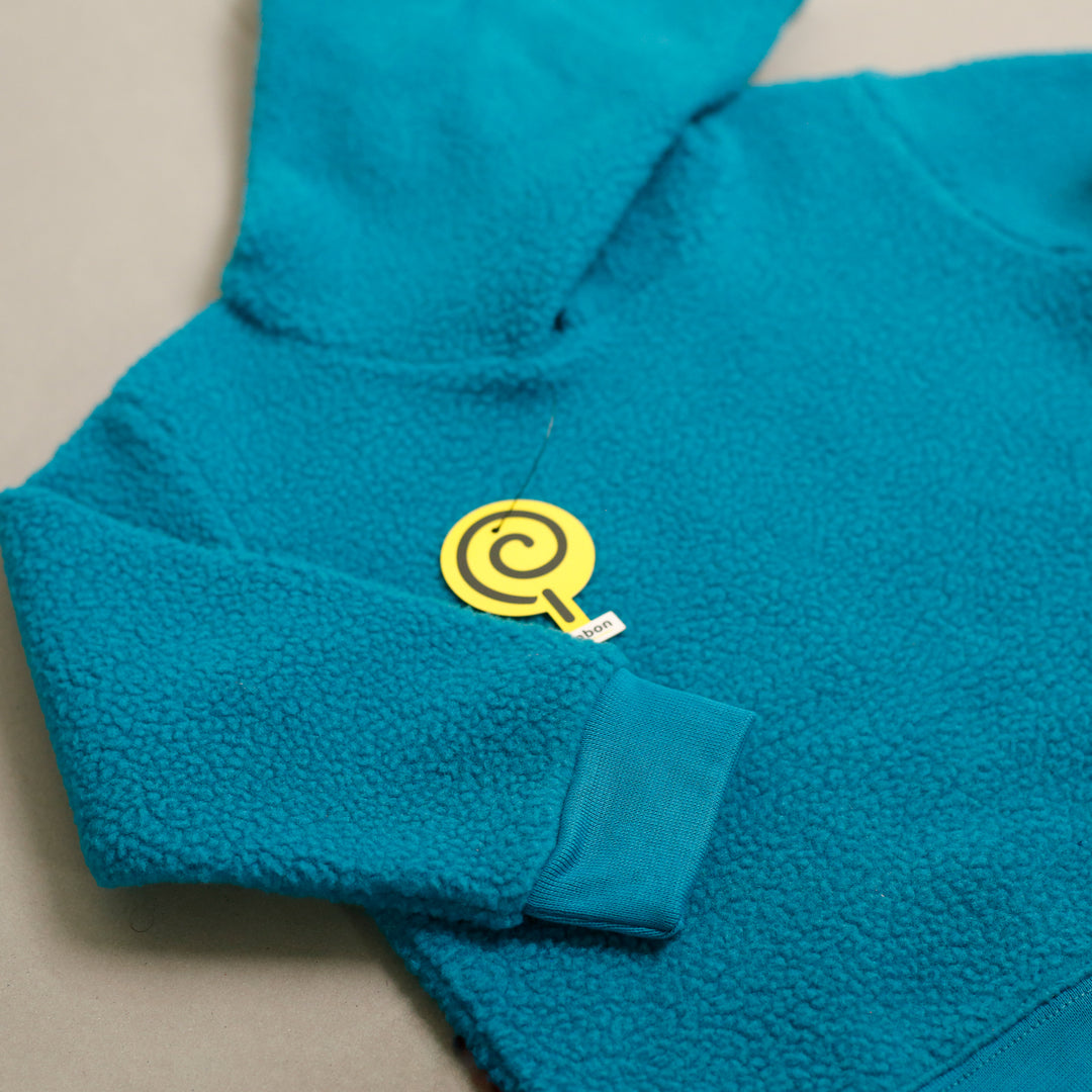 Turquoise Sherpa Tracksuit hoodie sleeve cuff close-up