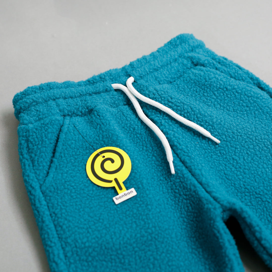 Turquoise Sherpa Tracksuit trousers waist and pocket close-up
